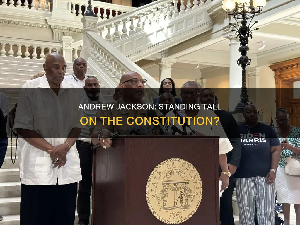 why is andrew jackson standing on the constitution